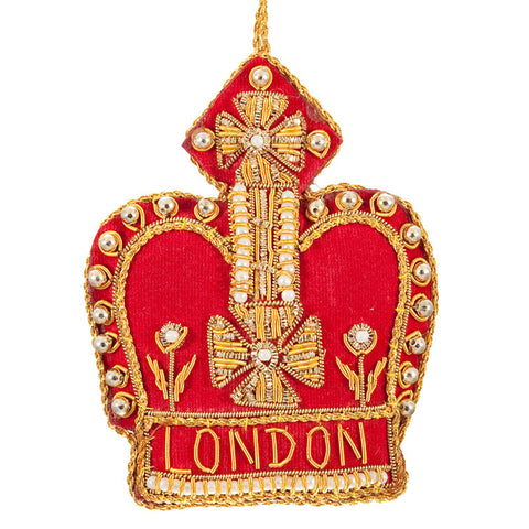Red fabric crown-shaped decoration with intricate gold and pearl beading.