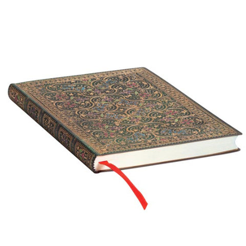 Filigree design on the cover of a notebook with red ribbon bookmark.